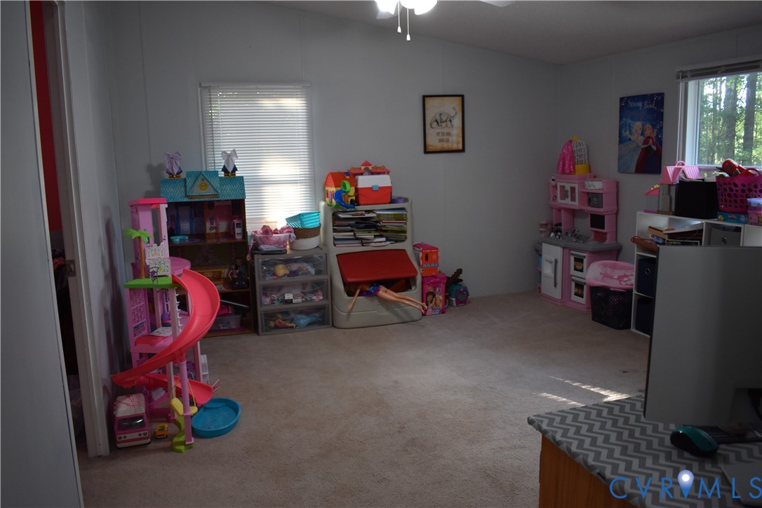 26049 Guy Place Road Courtland, VA 23837 - Photo 21 of 24 Carpeted room featuring light gray walls, a sloped