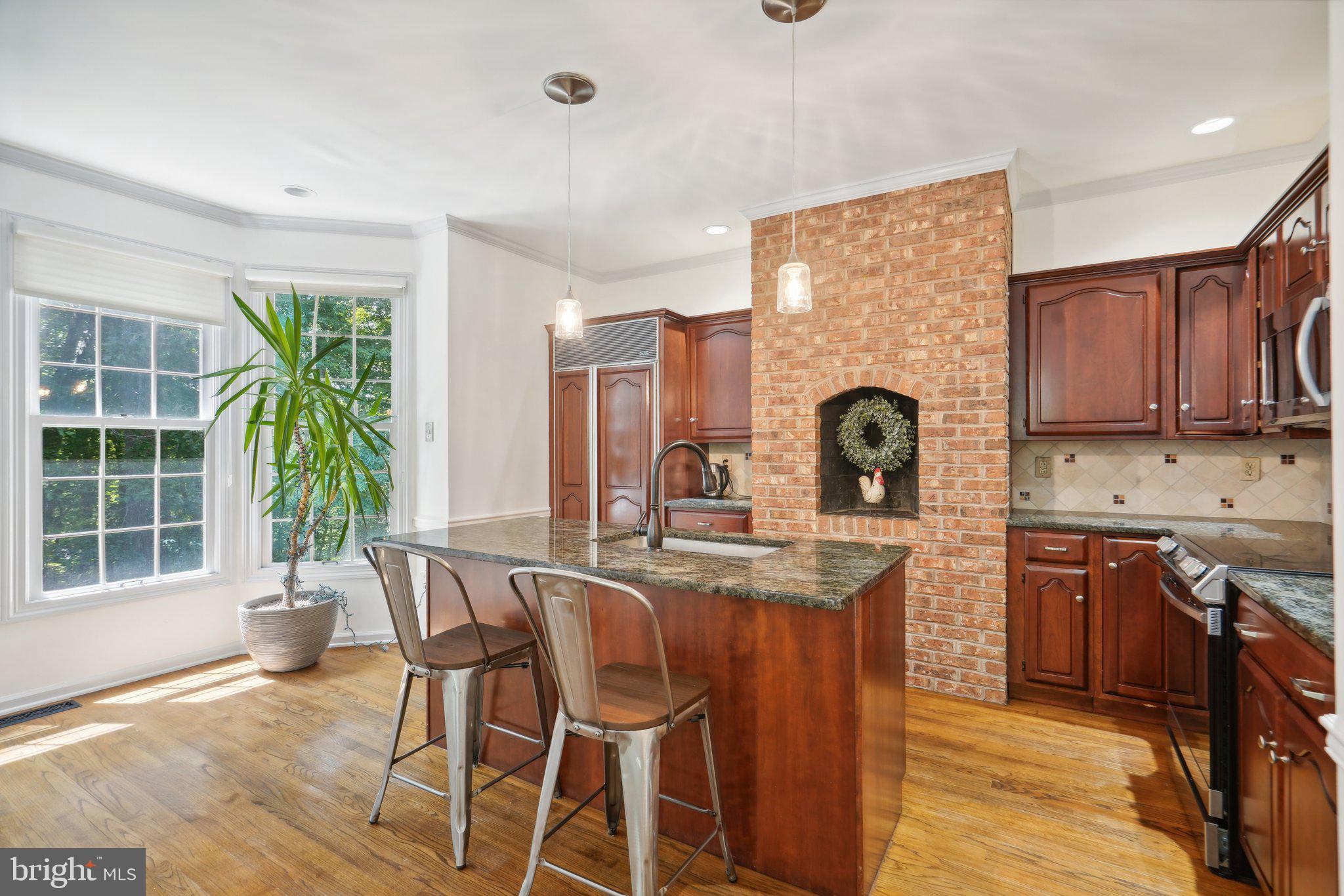 49 Sentinel Road Washington Crossing, PA 18977 - Photo 3 of 42 Kitchen and lovely brick fireplace