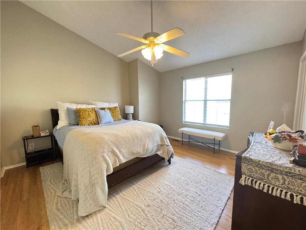 2104 Queen Anne Court Sandy Springs, GA 30350 - Photo 14 of 29 a bedroom with a bed and a window