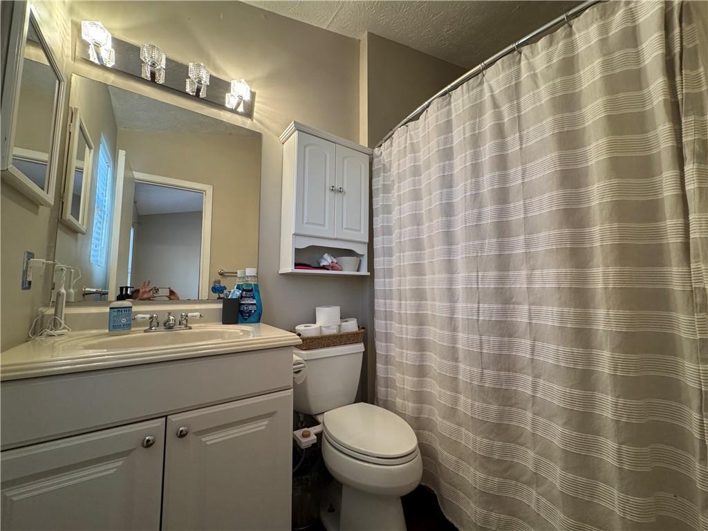 2104 Queen Anne Court Sandy Springs, GA 30350 - Photo 17 of 29 a bathroom with a sink toilet and shower