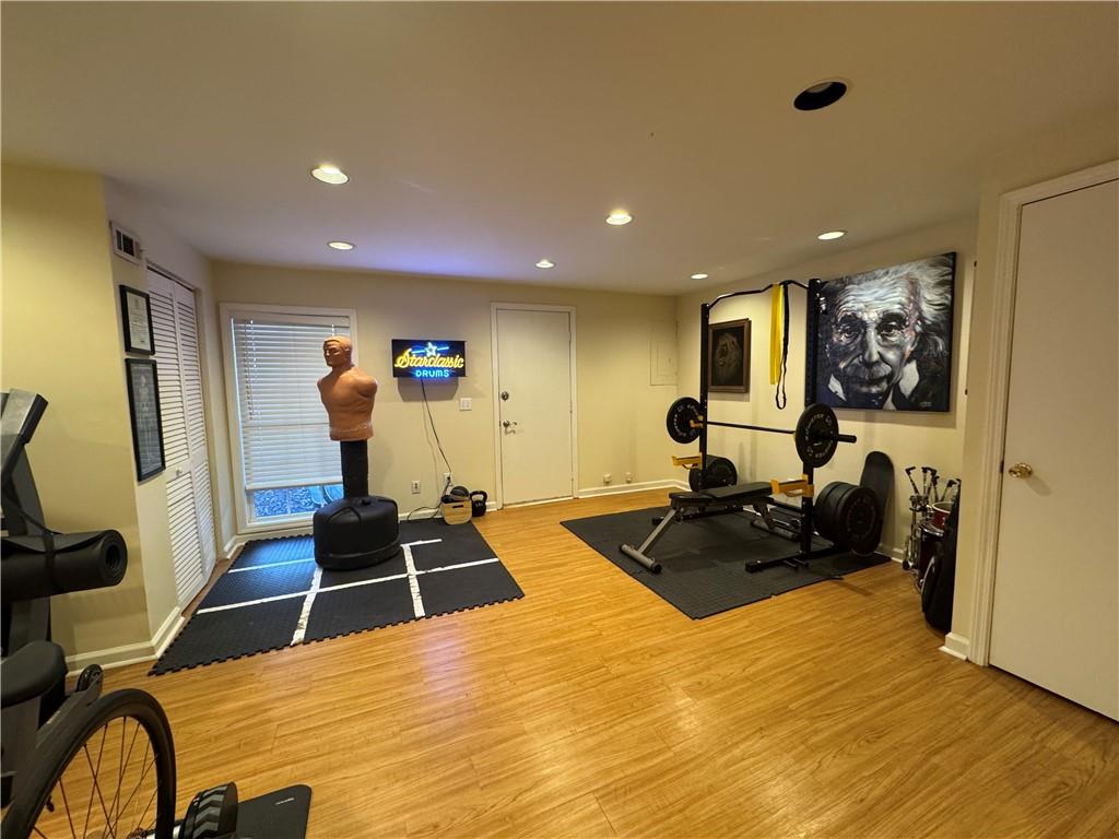 2104 Queen Anne Court Sandy Springs, GA 30350 - Photo 19 of 29 a room with furniture and a flat screen tv