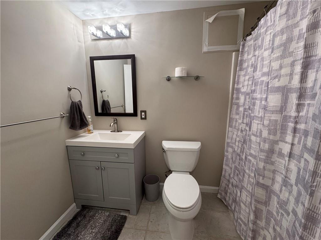 2104 Queen Anne Court Sandy Springs, GA 30350 - Photo 22 of 29 a bathroom with a toilet sink and mirror