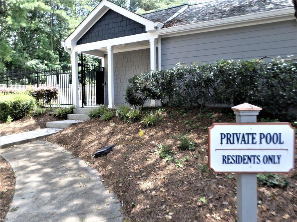 2104 Queen Anne Court Sandy Springs, GA 30350 - Photo 28 of 29 a sign on the side of a building