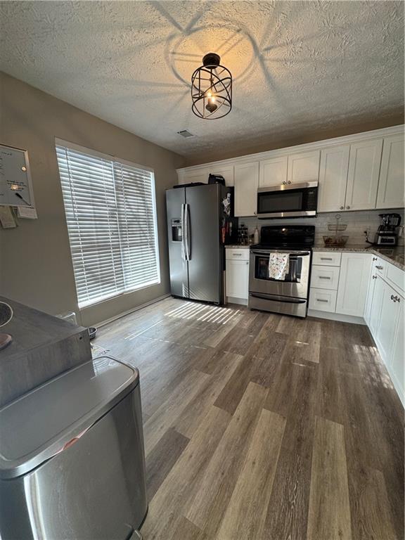 2104 Queen Anne Court Sandy Springs, GA 30350 - Photo 7 of 29 a view of a kitchen with a sink cabinets and a stove top oven