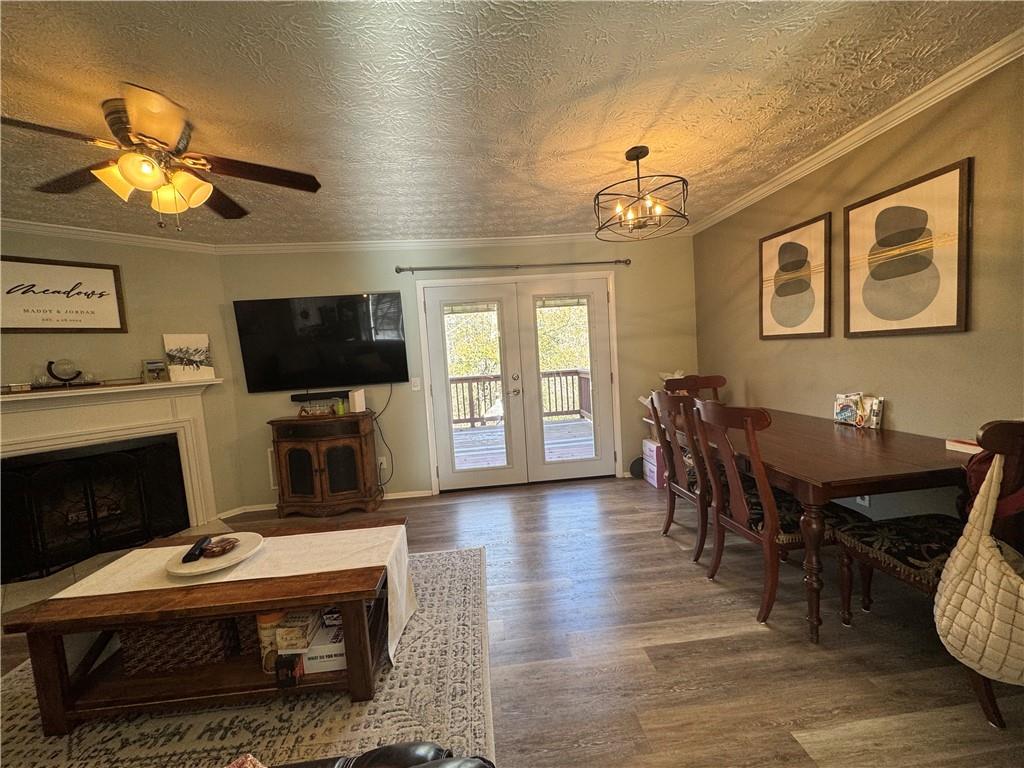2104 Queen Anne Court Sandy Springs, GA 30350 - Photo 8 of 29 a living room with furniture a fireplace and a flat screen tv