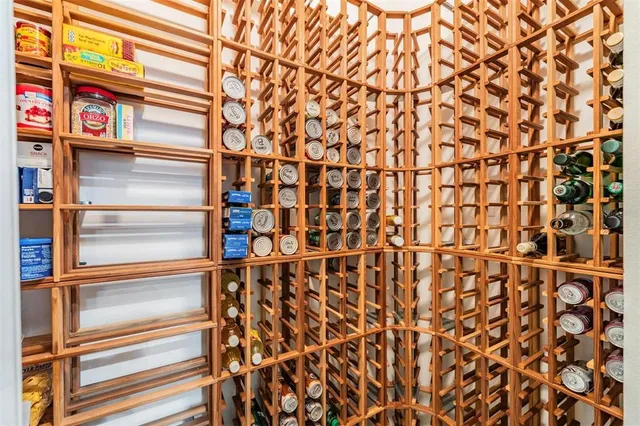 a view of a dining room with furniture wooden floor and chandelier
