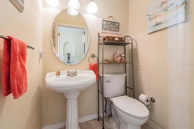 a bed room with a bed mirror and a window