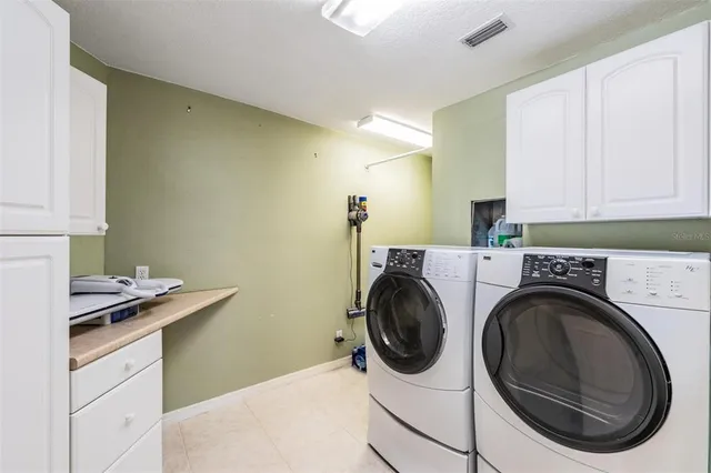 a bedroom with a large bed and a large window