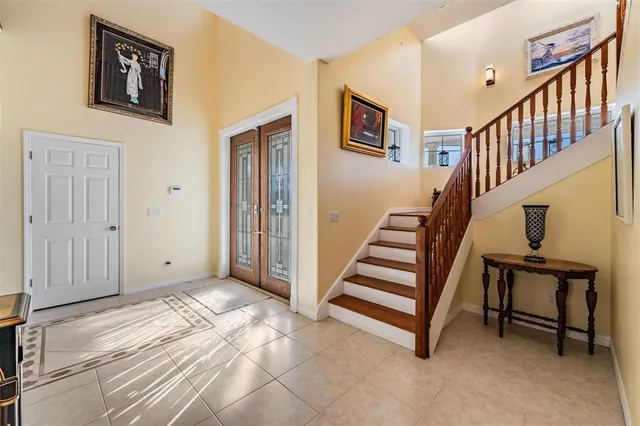 a bathroom with a shower a sink and a mirror