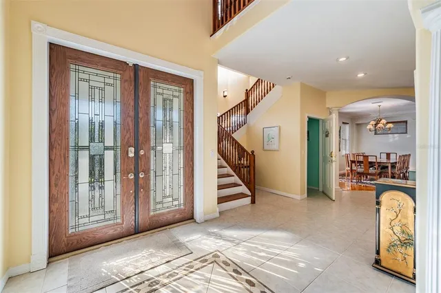a view of a livingroom with furniture and staircase