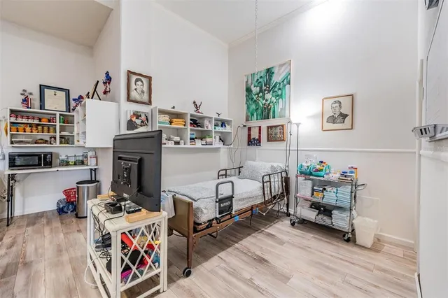 a front view of a building with a garden