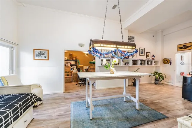 a view of a balcony with wooden floor