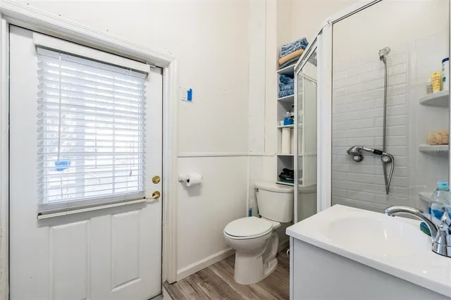a view of a balcony with wooden floor