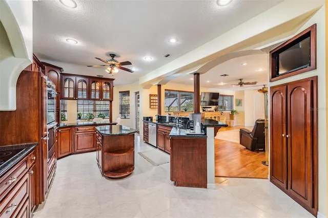 a kitchen with stainless steel appliances granite countertop a stove and a sink