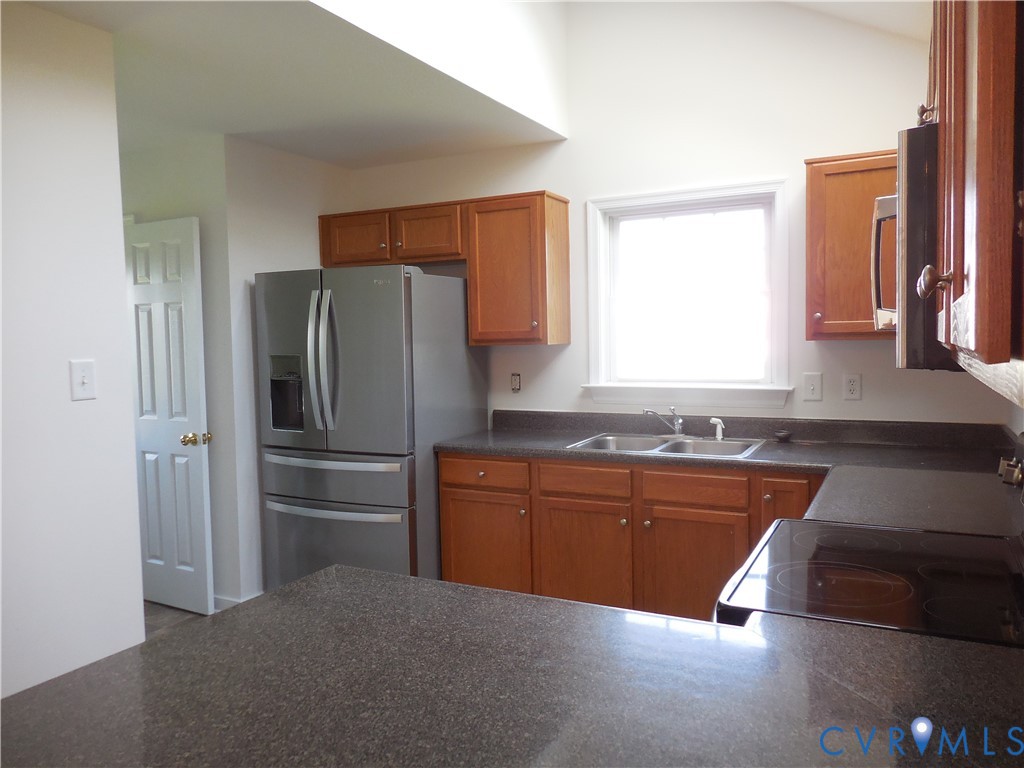 1781 Rolling Path Road Mineral, VA 23117 - Photo 4 of 23 Kitchen featuring wood cabinetry, dark speckled co