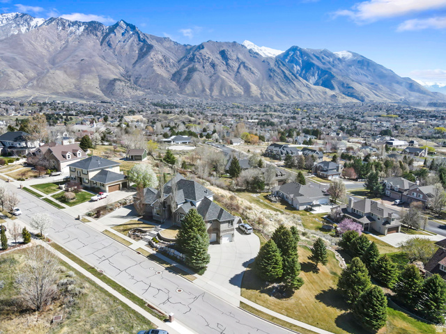 684 North Summit Way Alpine, UT 84004 - Photo 11 of 58 Aerial perspective of suburban area with a mountainous background