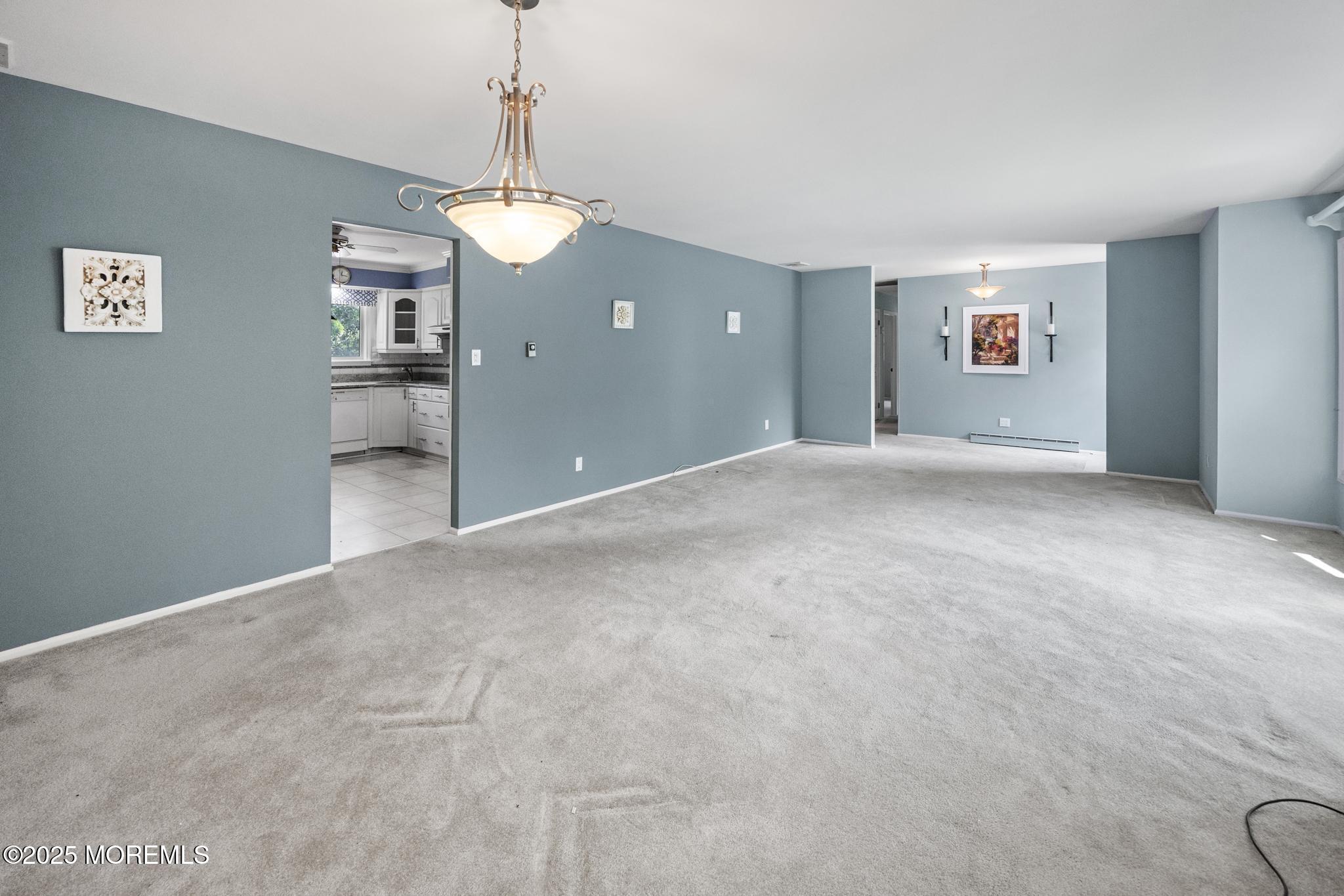 65 Pineland Road Brick, NJ 08724 - Photo 12 of 47 a view of a room with a stylish ceiling fan and entryway