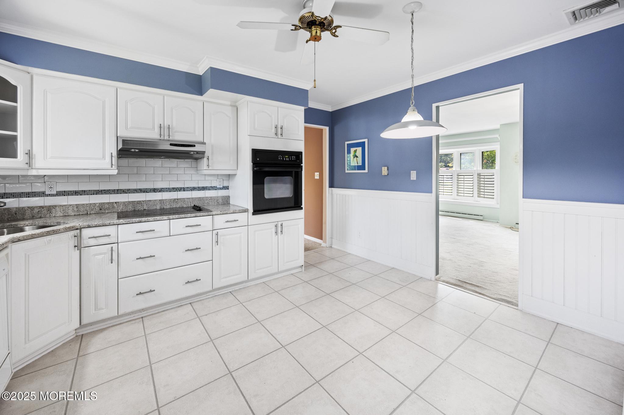 65 Pineland Road Brick, NJ 08724 - Photo 15 of 47 a kitchen with granite countertop white cabinets and white appliances