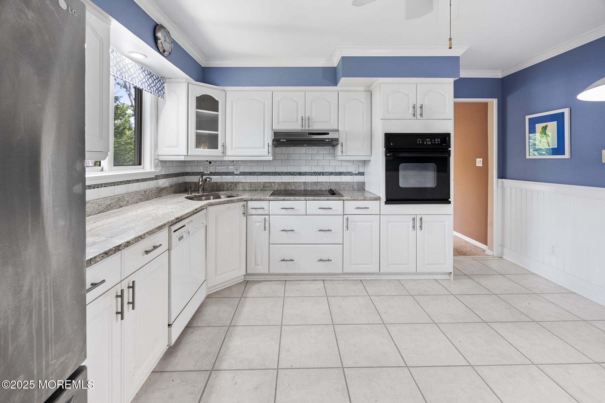65 Pineland Road Brick, NJ 08724 - Photo 16 of 47 a kitchen with white cabinets appliances and a window