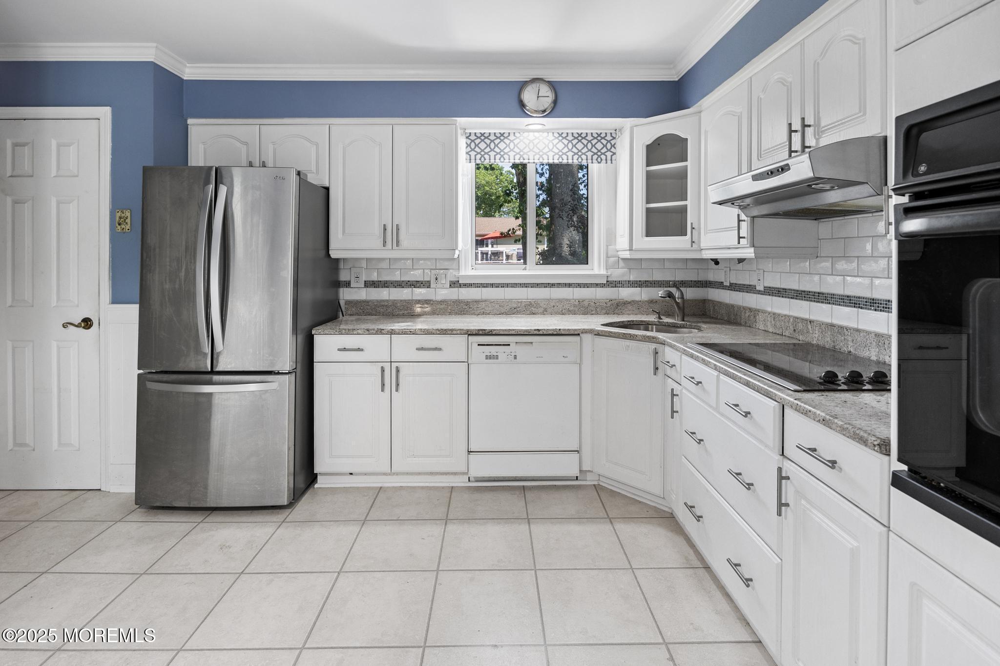 65 Pineland Road Brick, NJ 08724 - Photo 17 of 47 a kitchen with a stove a sink and a refrigerator