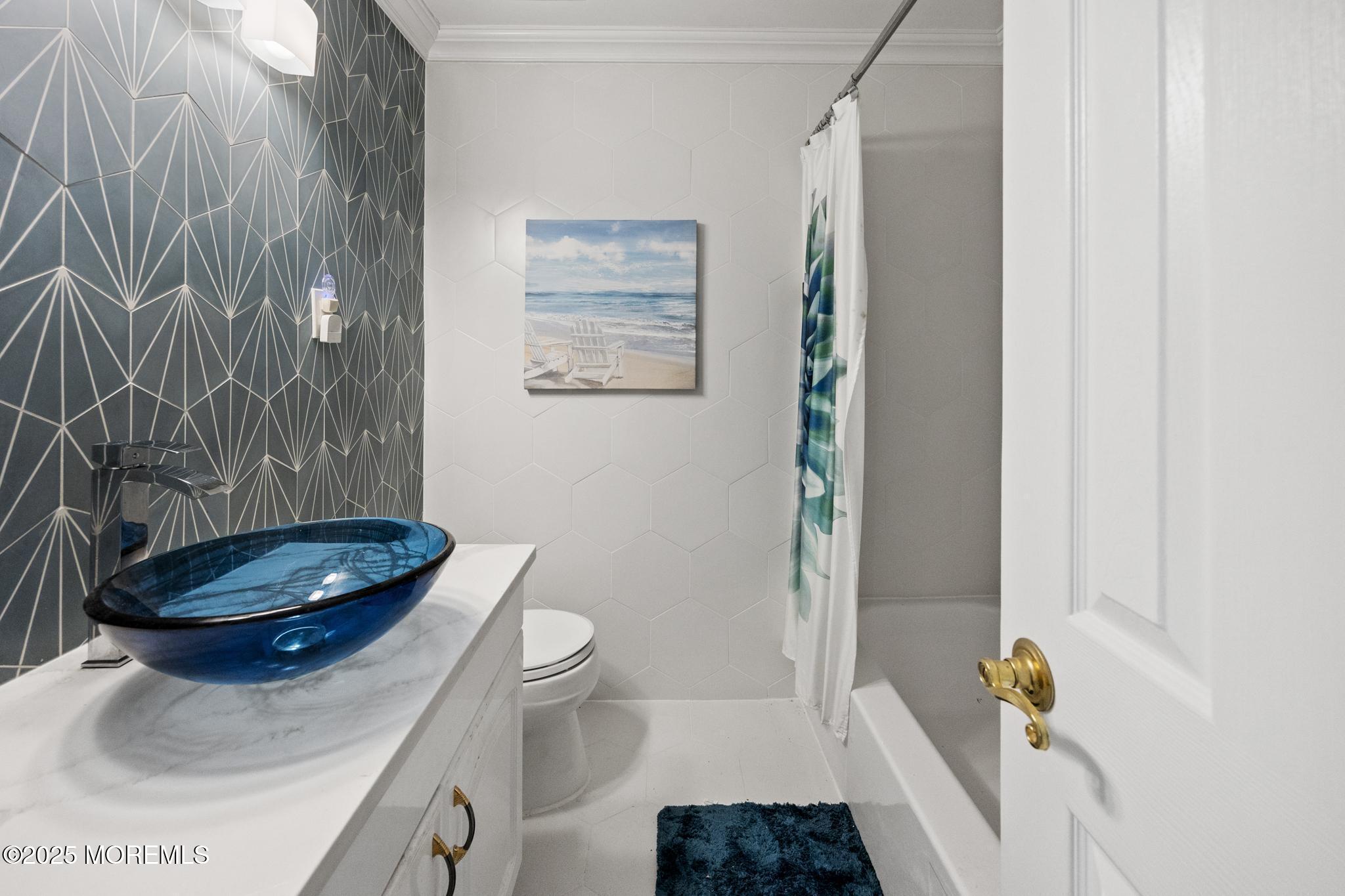 65 Pineland Road Brick, NJ 08724 - Photo 23 of 47 a bathroom with a toilet and a mirror