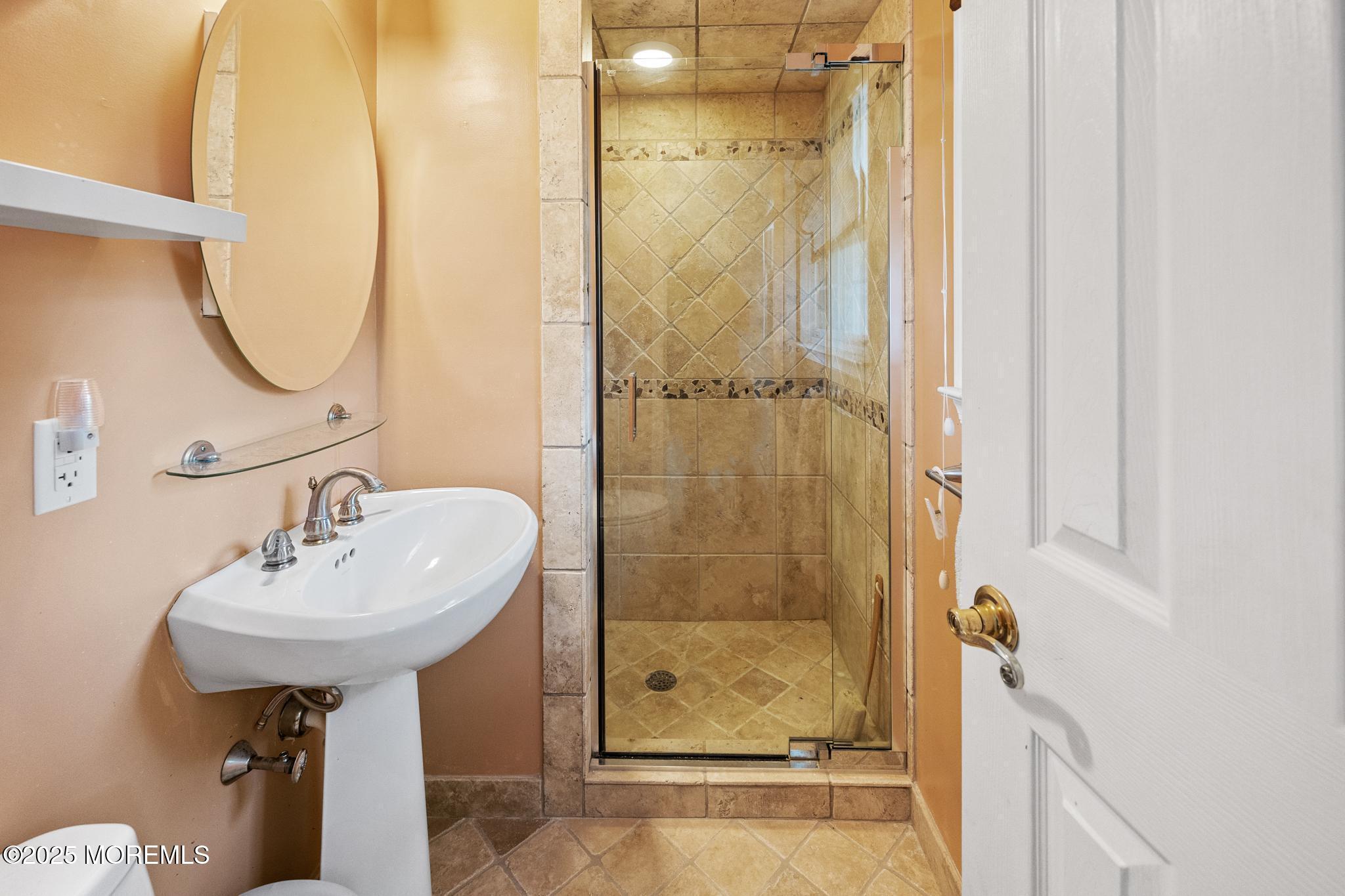 65 Pineland Road Brick, NJ 08724 - Photo 32 of 47 a bathroom with a sink a shower and a mirror
