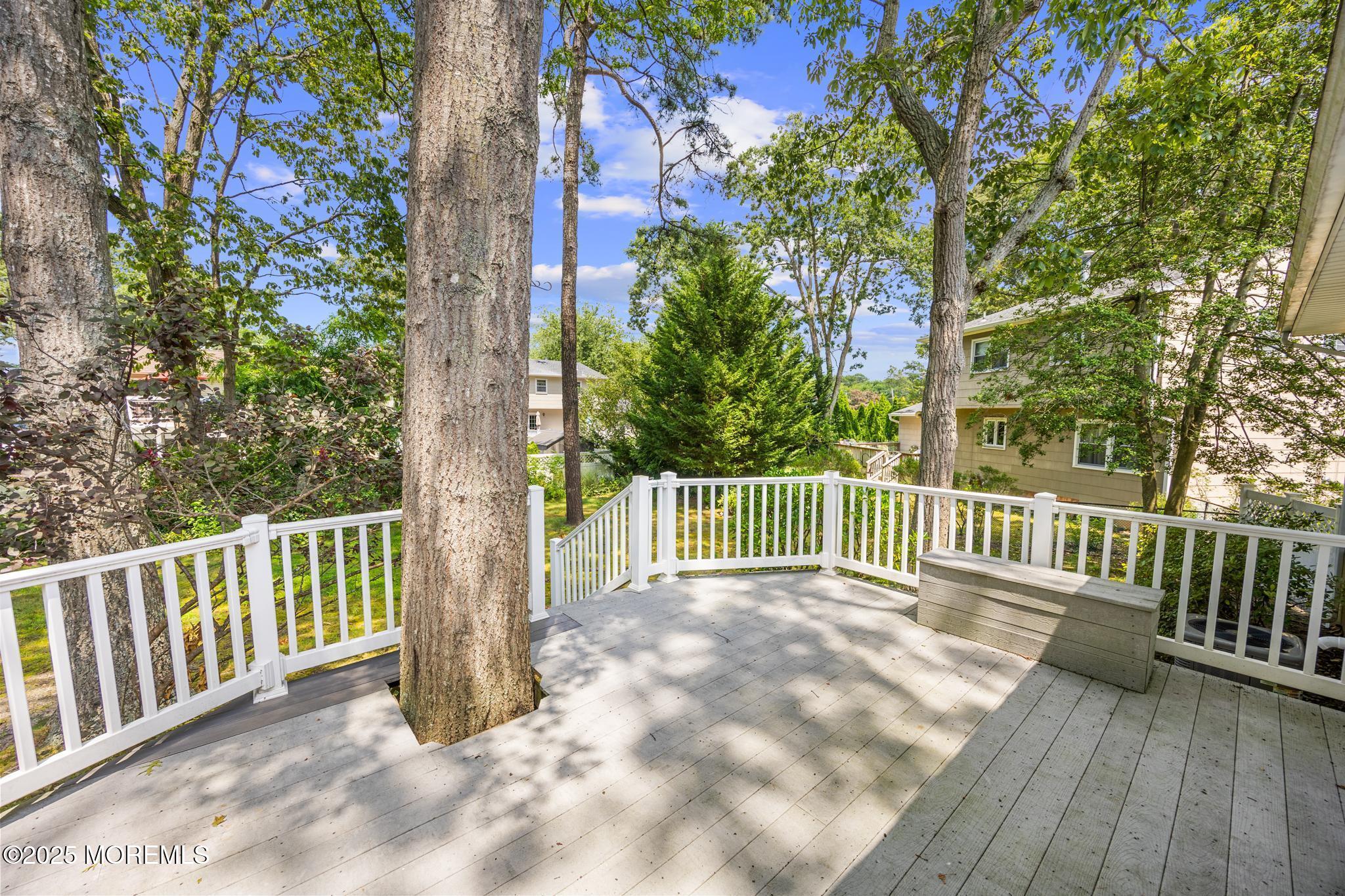 65 Pineland Road Brick, NJ 08724 - Photo 38 of 47 a view of a deck with a large window and wooden fence