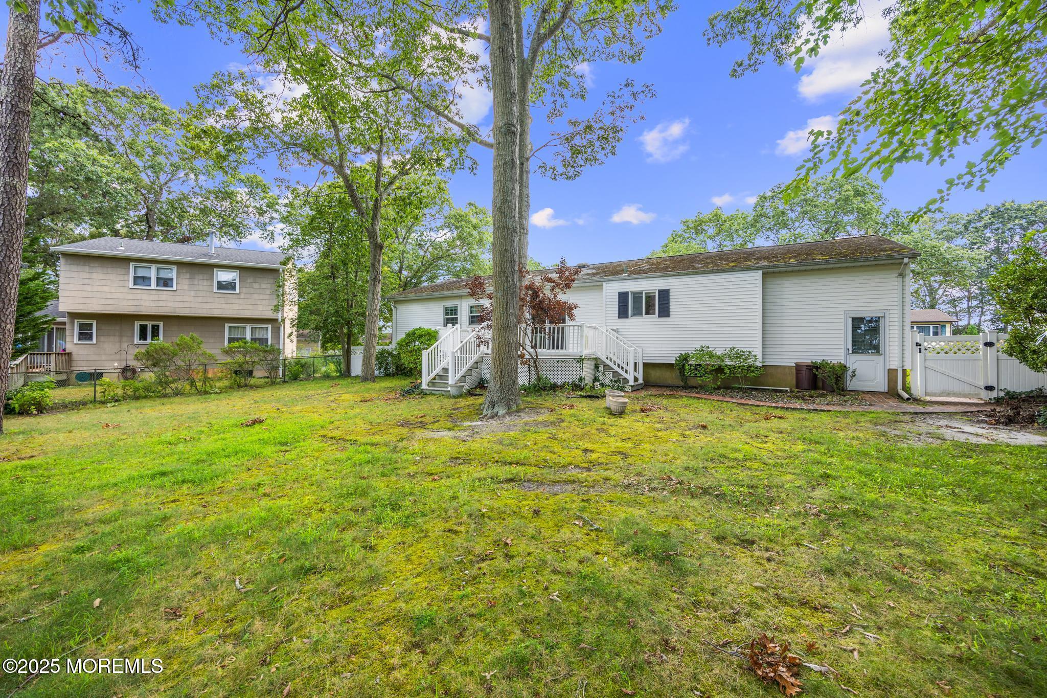 65 Pineland Road Brick, NJ 08724 - Photo 39 of 47 a view of a house with backyard and sitting area