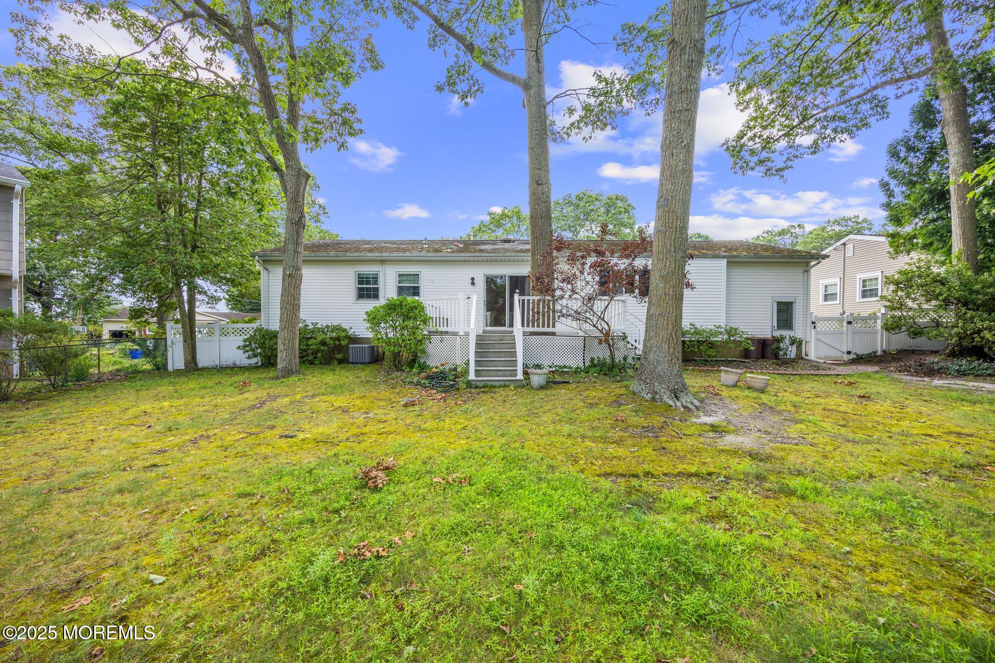 65 Pineland Road Brick, NJ 08724 - Photo 40 of 47 a house view with a garden space