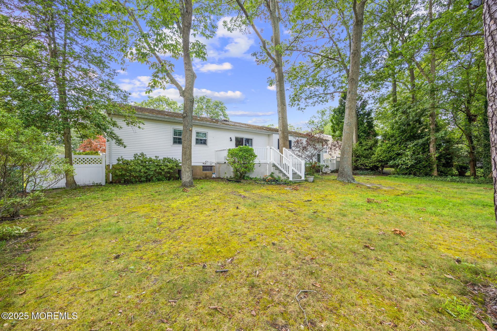 65 Pineland Road Brick, NJ 08724 - Photo 41 of 47 a view of a backyard with a garden