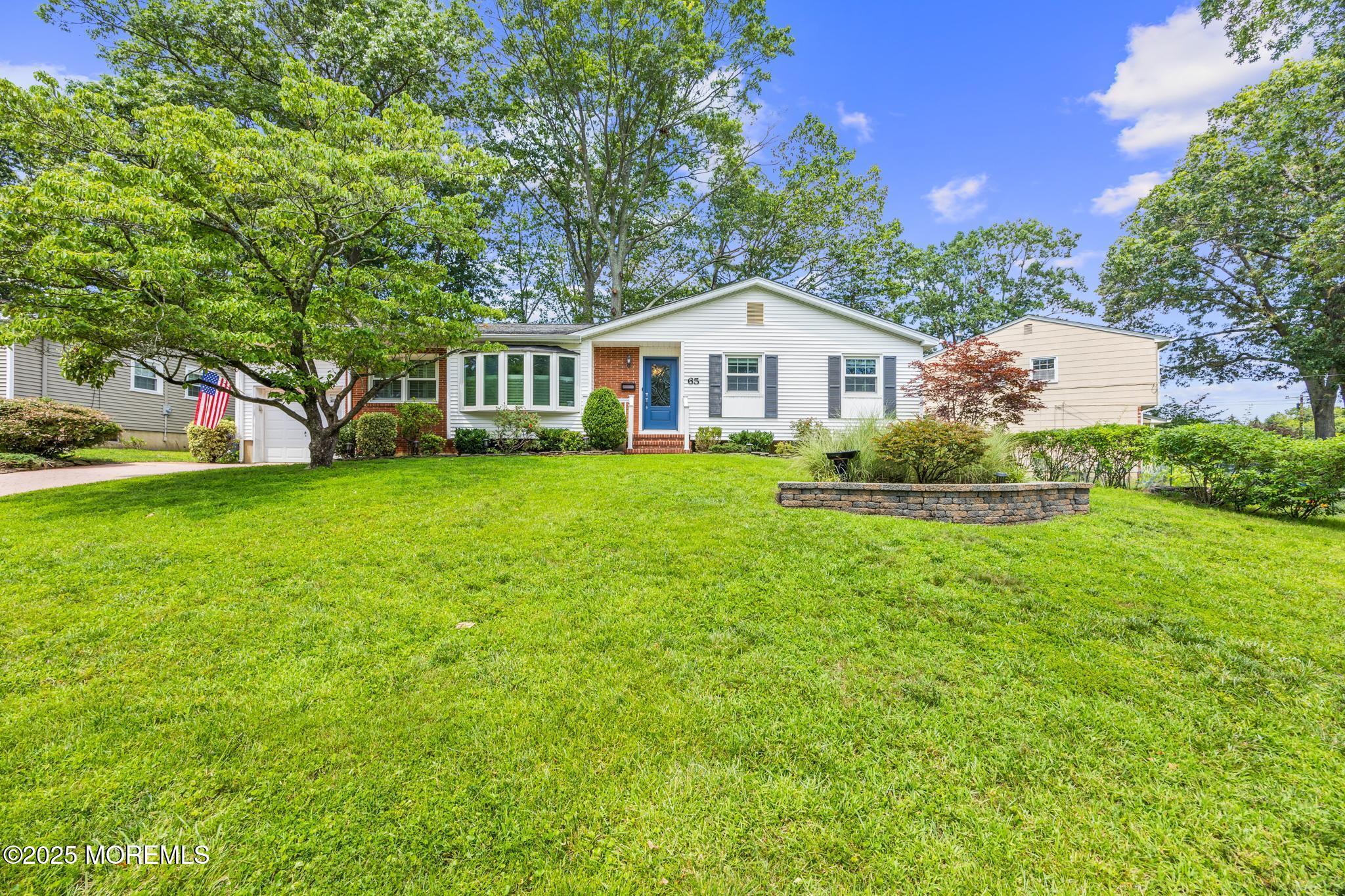 65 Pineland Road Brick, NJ 08724 - Photo 5 of 47 a front view of a house with a garden