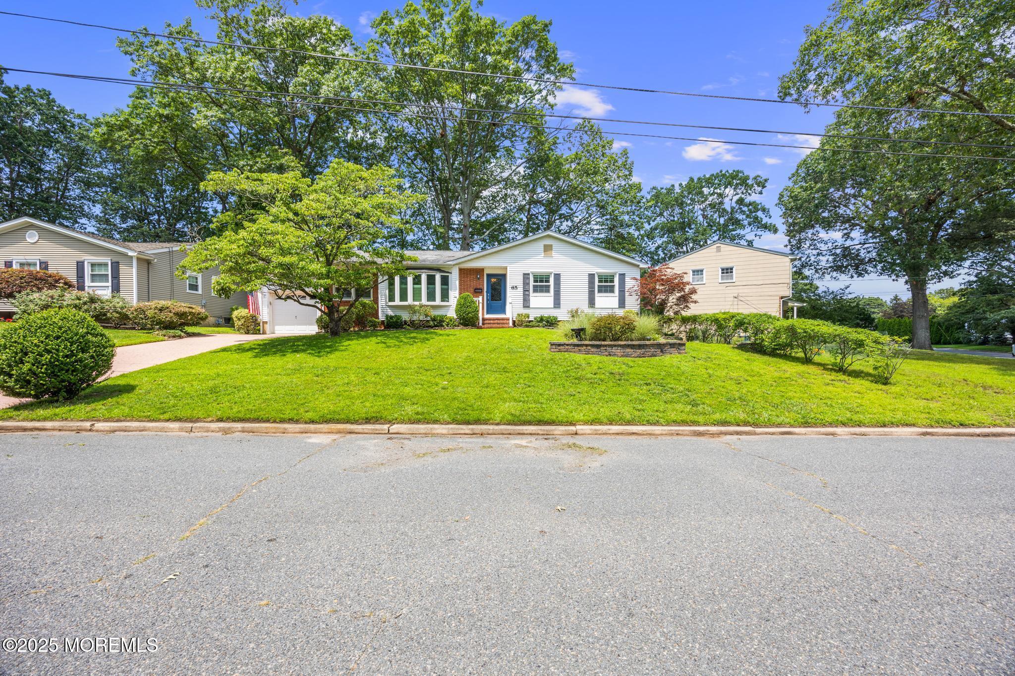 65 Pineland Road Brick, NJ 08724 - Photo 6 of 47 a view of a house with a yard and palm trees