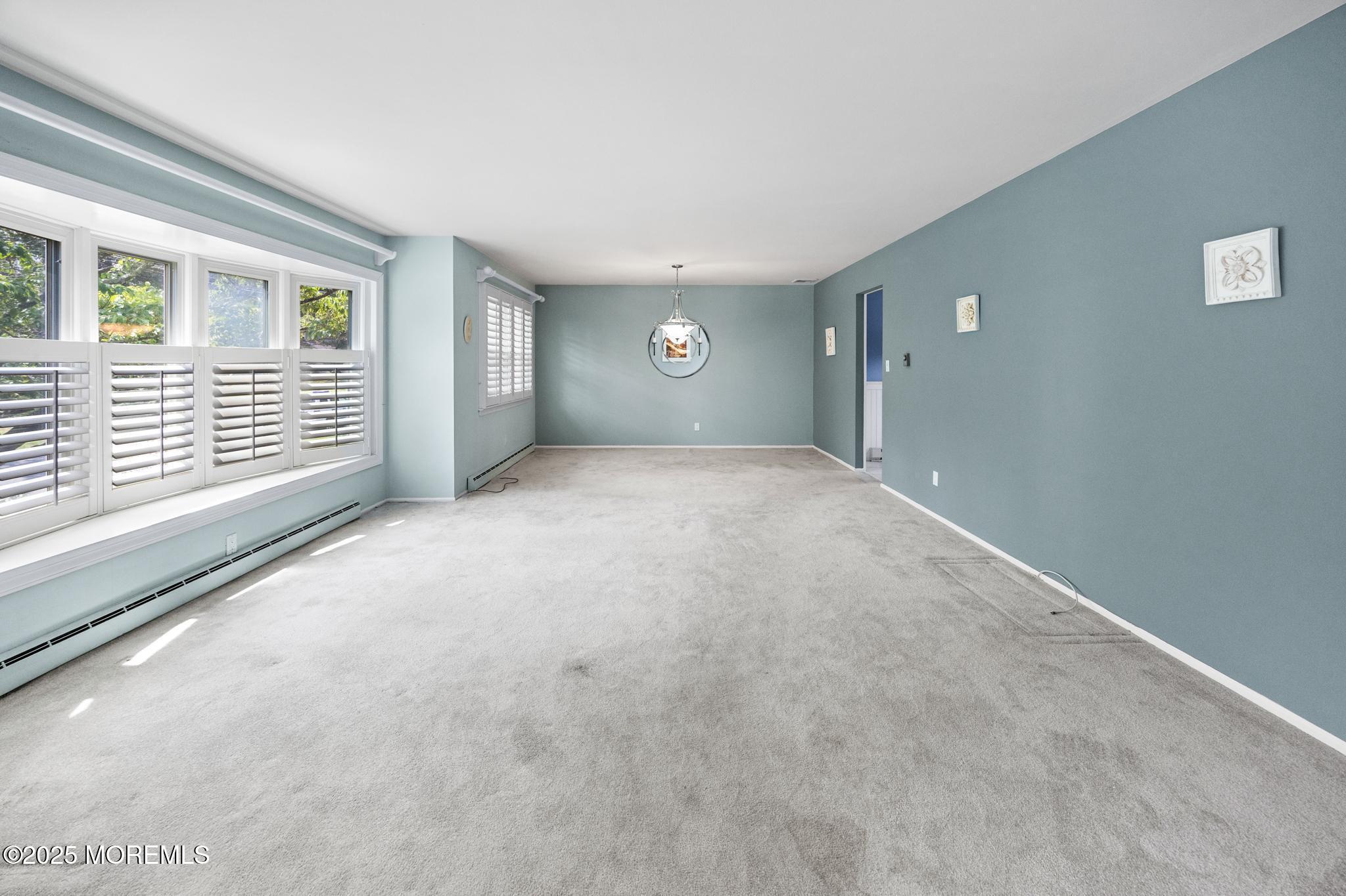 65 Pineland Road Brick, NJ 08724 - Photo 10 of 47 a view of a livingroom with a staircase