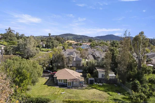 a view of a lake in front of a house
