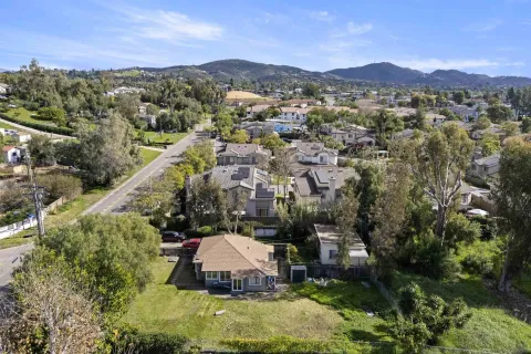 a view of a town with mountains in the background