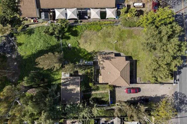 an aerial view of a house with a garden