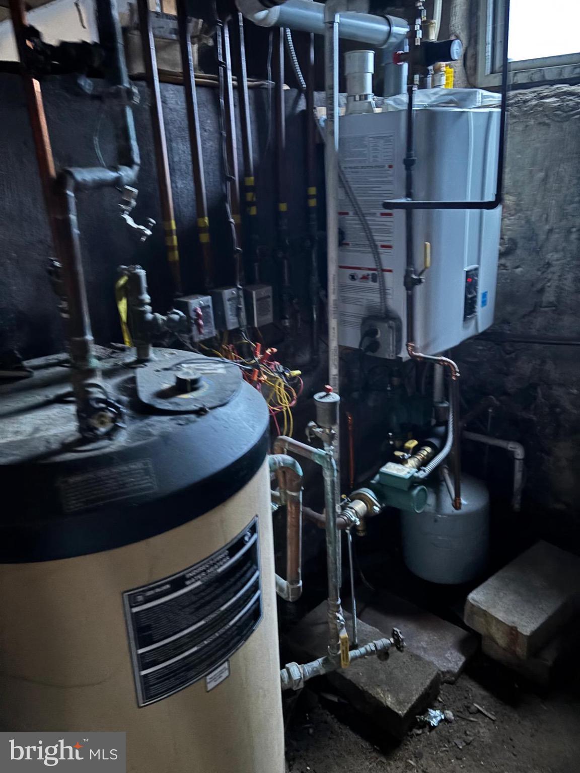 867 Beverly Road Burlington, NJ 08016 - Photo 22 of 23 Utility room with water heating systems.
