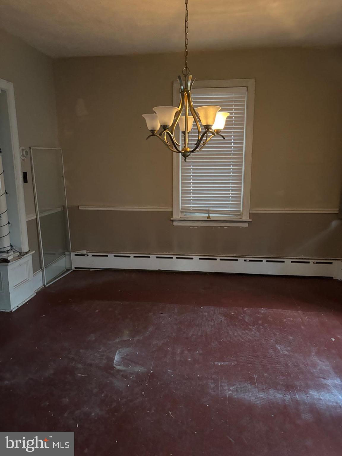 867 Beverly Road Burlington, NJ 08016 - Photo 3 of 23 Spacious room with classic chandelier charm.