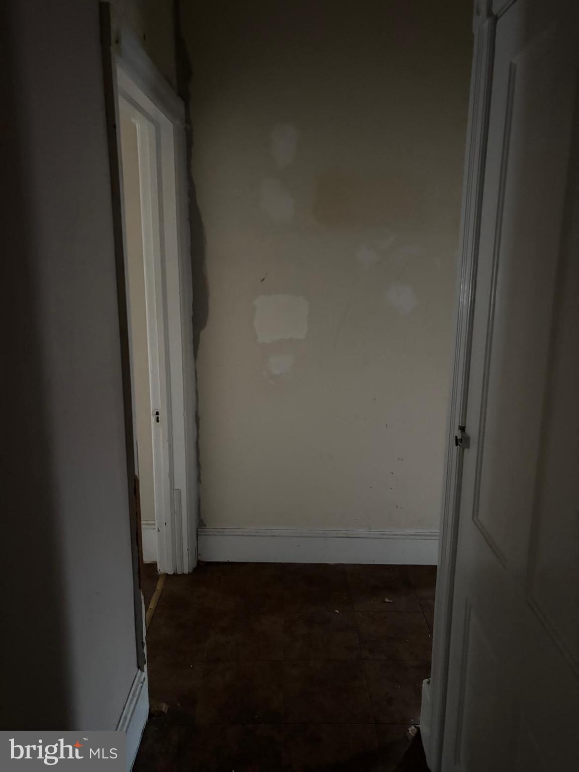 867 Beverly Road Burlington, NJ 08016 - Photo 7 of 23 Empty hallway with potential for renewal.