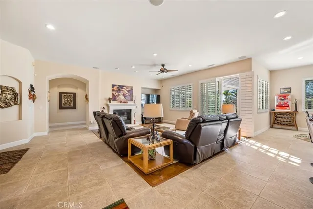 a living room with furniture flat screen tv and a fireplace