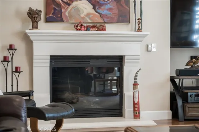 a view of a bedroom with wooden floor windows and entryway