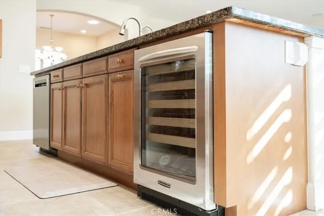 a large white kitchen with a large window