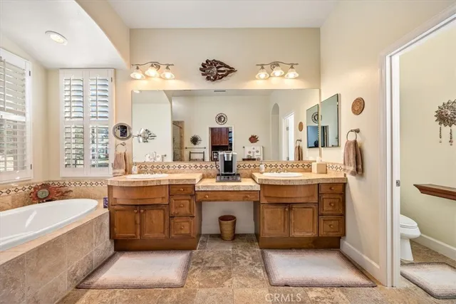 a bedroom with a bed and a dresser in it