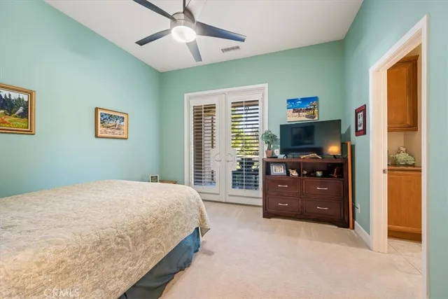 a building outdoor space with patio furniture and garden