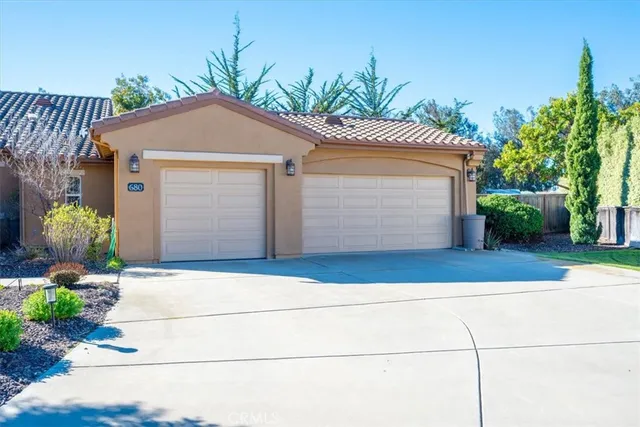 a front view of a house with swimming pool having outdoor seating