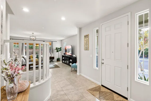 a very nice looking room with a large window and furniture