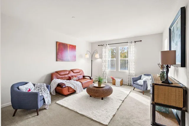 a bedroom with furniture and a window
