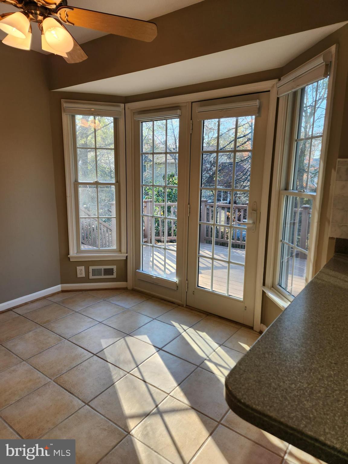 8230 Riverside Road Alexandria, VA 22308 - Photo 17 of 49 Great view of the deck from the kitchen table