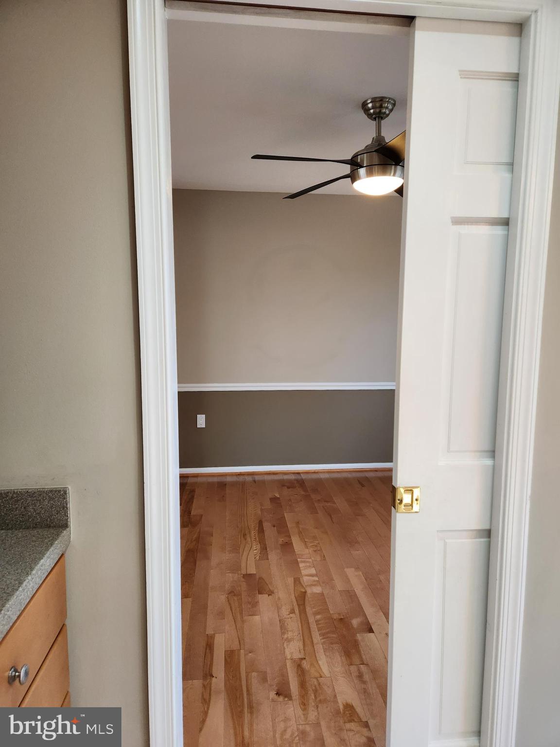 8230 Riverside Road Alexandria, VA 22308 - Photo 22 of 49 Pocket door to dining room, ceiling fan