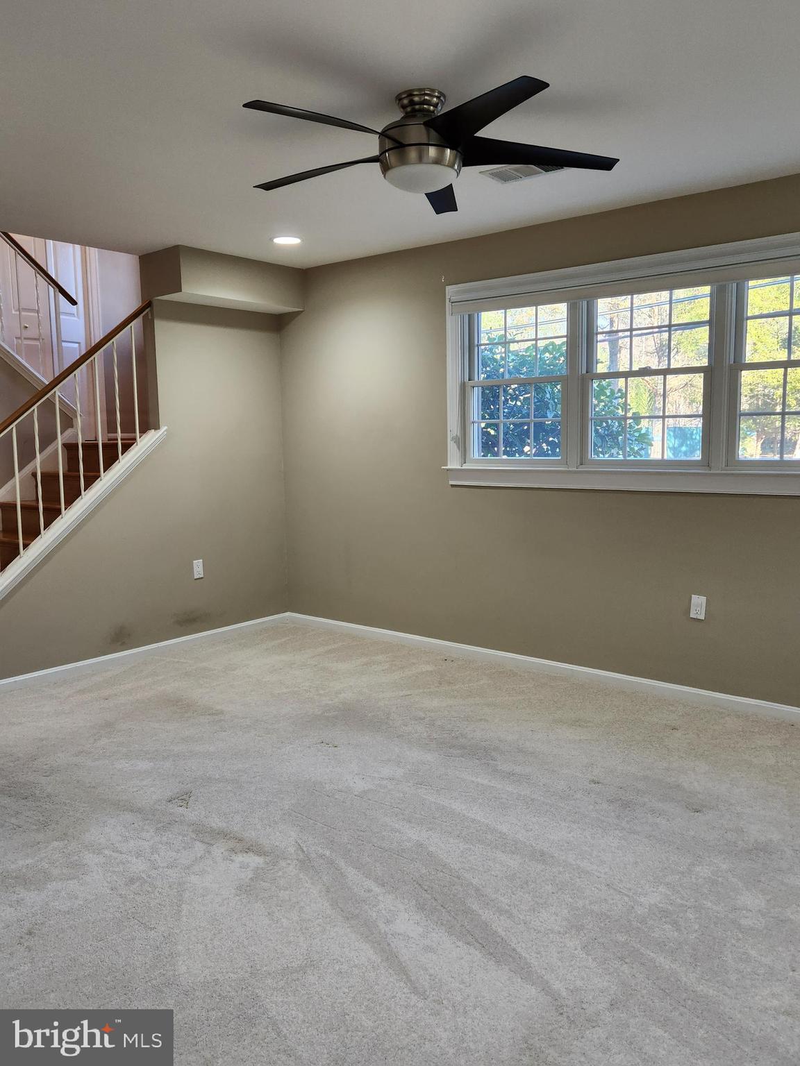 8230 Riverside Road Alexandria, VA 22308 - Photo 32 of 49 Stairs to family room. Large windows